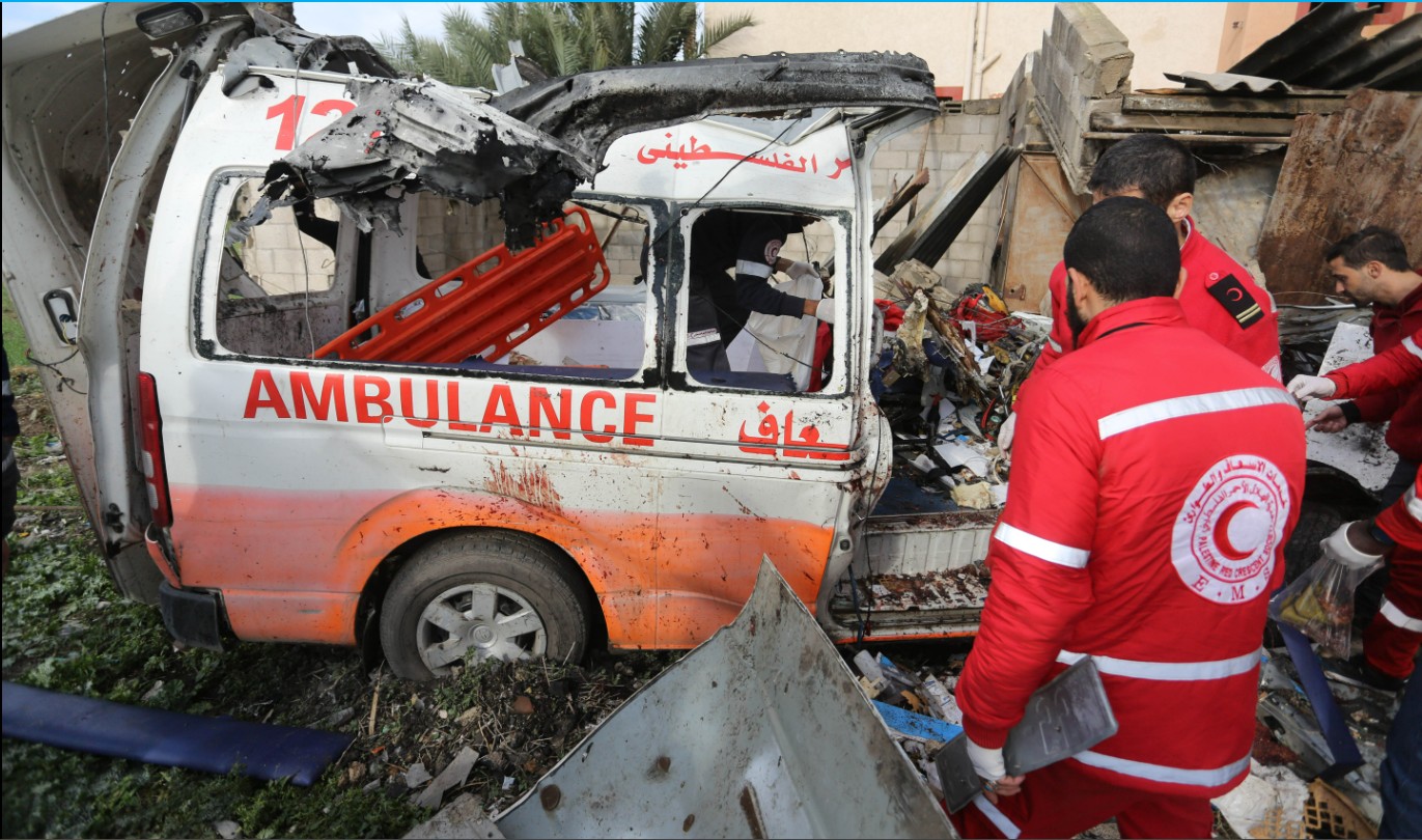 11 January 2024, Palestinian Red Crescent personnel inspect a destroyed ambulance in Deir el Balah central Gaza Strip | © UNRWA Photo by Ashraf Amra