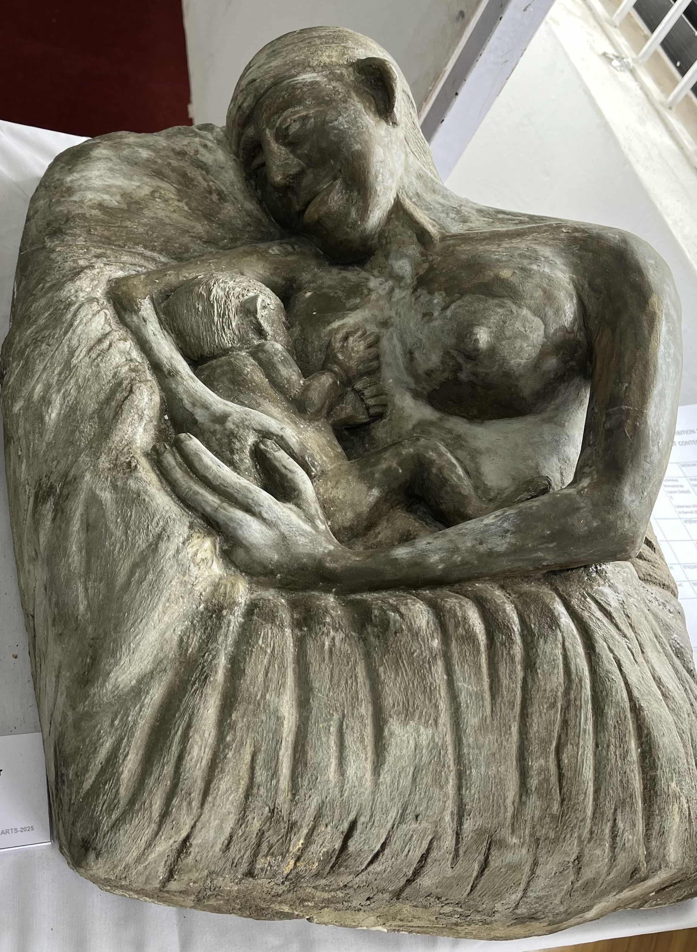 Sculpture of a Raute woman breast-feeding her child. Rautes are the indigenous nomadic people moving through forests of western Nepal, majorly Dailekh, Jajarkot, Surkhet, Achham, Dang, Salyaan and Kalikot. Termed as the country’s last nomads, they’re well known for their unique way of life and Raute (Khamci) language.
