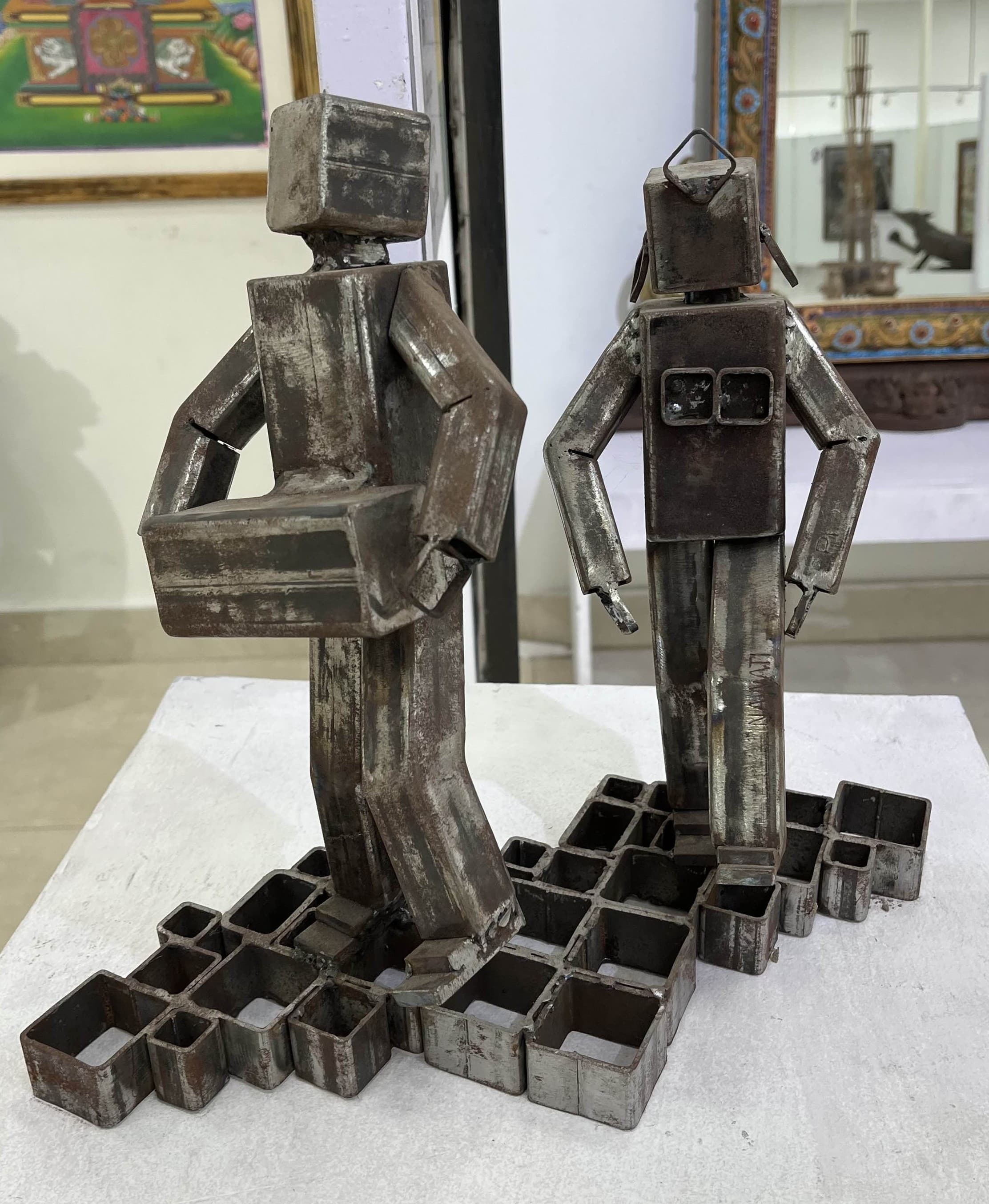 A metal artwork representing Kelang dance—a rhythmic dance form practised by the Limbu and Yamphu communities with the beat of Chyabrung, the double-sided drum.